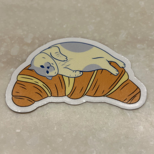 Croissant bed | Reusable Sticker, Cat Stickers, Kawaii Sticker, waterbottle Sticker, Laptop Sticker, Tear-proof sticker, Cat on a croissant - Christy Chan | Artist
