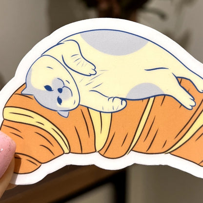 Croissant bed | Reusable Sticker, Cat Stickers, Kawaii Sticker, waterbottle Sticker, Laptop Sticker, Tear-proof sticker, Cat on a croissant - Christy Chan | Artist