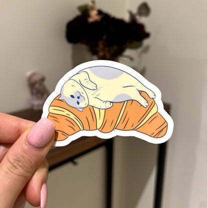 Croissant bed | Reusable Sticker, Cat Stickers, Kawaii Sticker, waterbottle Sticker, Laptop Sticker, Tear-proof sticker, Cat on a croissant - Christy Chan | Artist